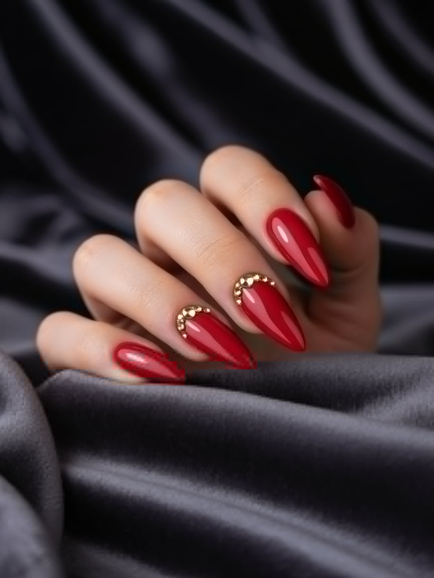 Red Stiletto Nails with Gold Rhinestones